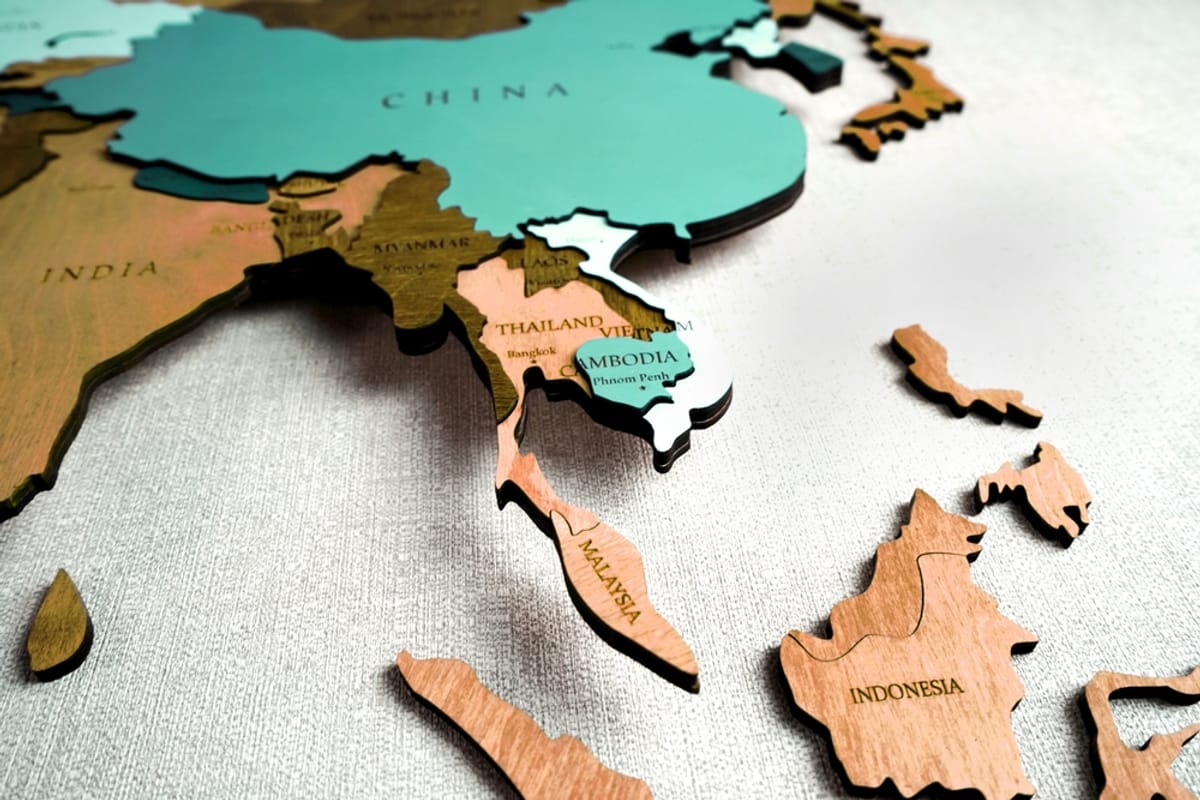 Asia highlighted on a political wooden world map